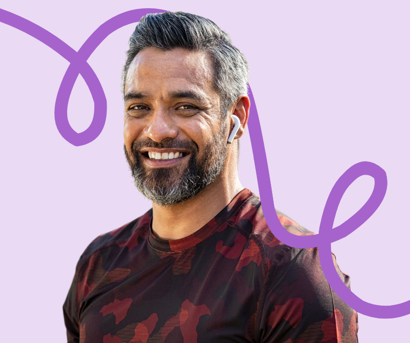 A man wearing headphones and exercising